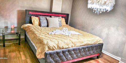 a bedroom with a bed with a black head board at 70 percent Off Luxurious Hot Tub,Sauna, 2000Sqft of Private in Vaughan