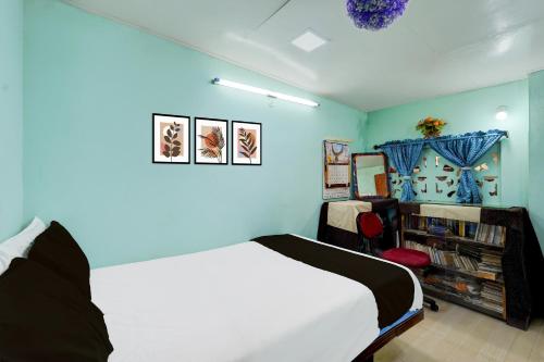 Ένα ή περισσότερα κρεβάτια σε δωμάτιο στο Hotel O PARAM HOMESTAY