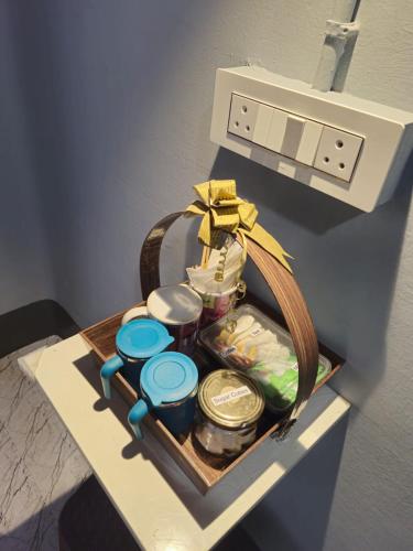 a basket of food and other items on a shelf at Faith Dorms in Siliguri