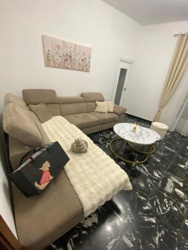 a living room with a couch and a table at Ca di nonni in Ortovero