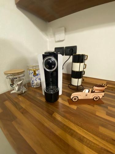 a coffee maker sitting on a hard wood floor at Ca di nonni in Ortovero