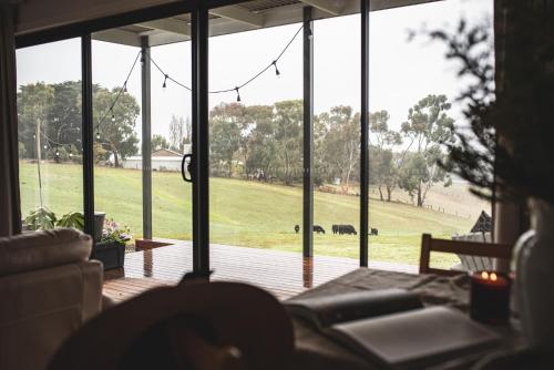 a view of a field from the inside of a house at kentonviewsestate in Gumeracha