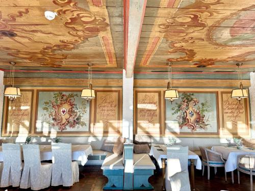 a dining room with white tables and white chairs at Sure Hotel by Best Western Rhoen Garden in Poppenhausen