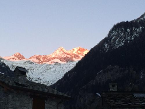 a view of a snow covered mountain in the distance at Rifugio Luna Nascente in San Martino