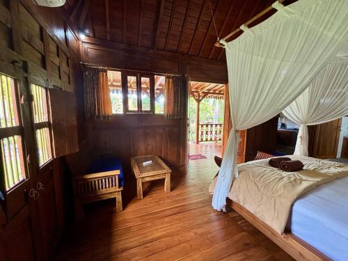 Katil atau katil-katil dalam bilik di Di Abian Villas