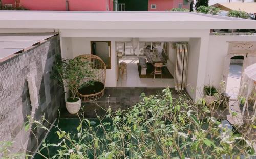 a view from the balcony of a house with plants at Villa S in Hua Hin