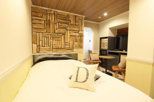 Postel nebo postele na pokoji v ubytování AND hotel