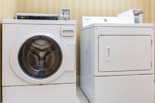 a washing machine and a dryer in a room at Days Inn by Wyndham Westminster in Westminster