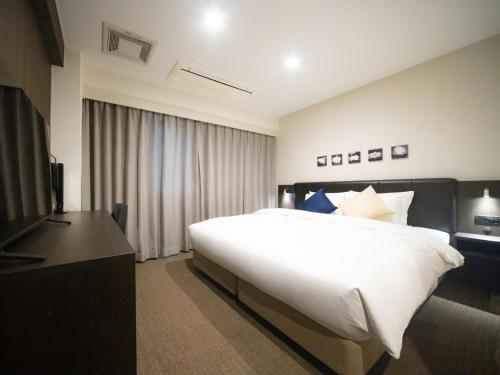 Postel nebo postele na pokoji v ubytování Hotel Shuranza Chiba