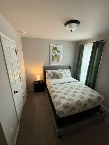 a small bedroom with a bed and a window at Gorgeous, Brand New 3 Bedrooms Home- Built 2024, Near SeaWorld & Lackland AFB in San Antonio