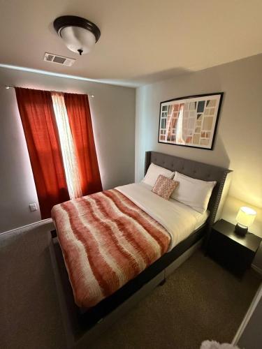 a bedroom with a bed and a window at Gorgeous, Brand New 3 Bedrooms Home- Built 2024, Near SeaWorld & Lackland AFB in San Antonio