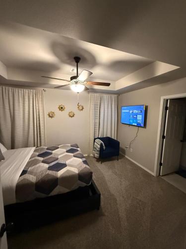 a bedroom with a bed and a ceiling fan at Gorgeous, Brand New 3 Bedrooms Home- Built 2024, Near SeaWorld & Lackland AFB in San Antonio