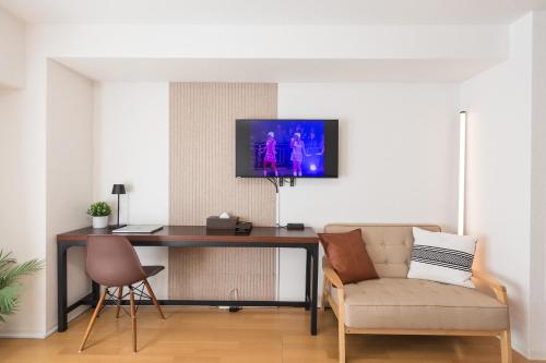 TV a/nebo společenská místnost v ubytování b&天下茶屋店
