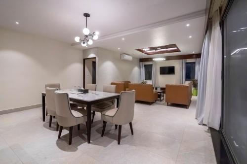 a dining room with a table and chairs at ila comfort in Bāglung