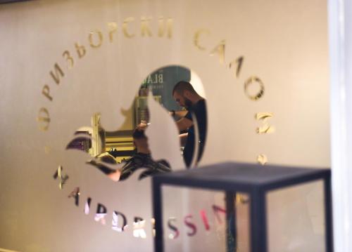 a man standing in front of a mirror at Хотел "Скалите", Skalite Hotel in Belogradchik