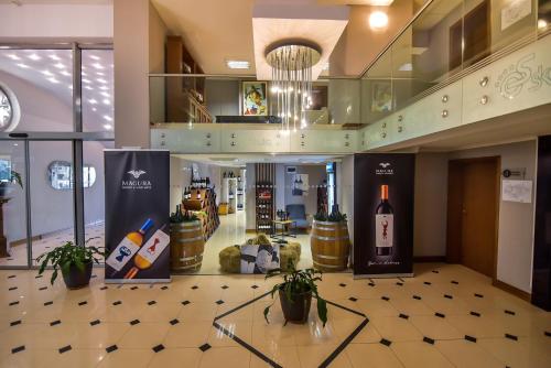a wine store with bottles of wine on display at Хотел "Скалите", Skalite Hotel in Belogradchik