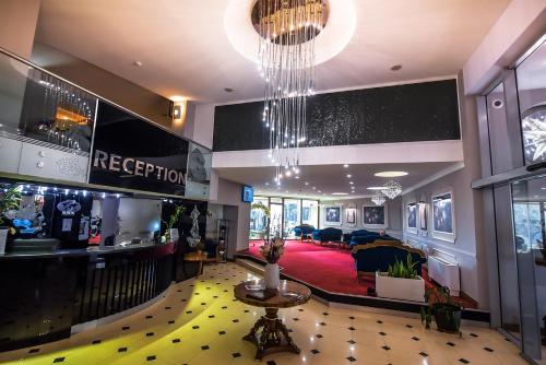 a lobby of a hotel with a reception area at Хотел "Скалите", Skalite Hotel in Belogradchik