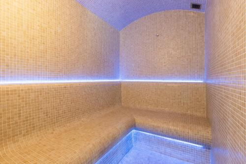 a bathroom with a bath tub with blue lights at Begoña Sea View in Fuengirola