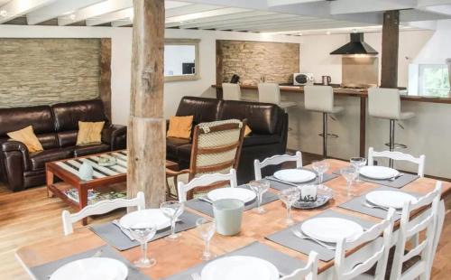 a dining room with a table and chairs at House with jacuzzi in Menufontaine, 180 m² for 8 people. in Menufontaine