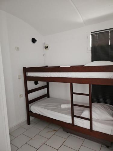 Una cama o camas en una habitación de CAPSUD, La Garde-Freinet
