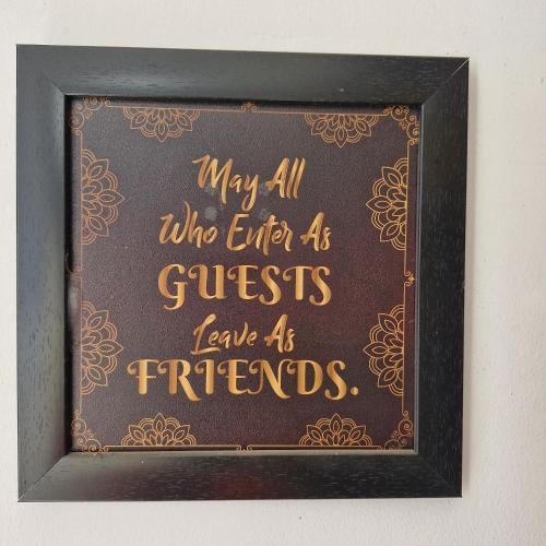 a framed picture of a chalkboard with a writing on it at Saatvik Homestay in Katra