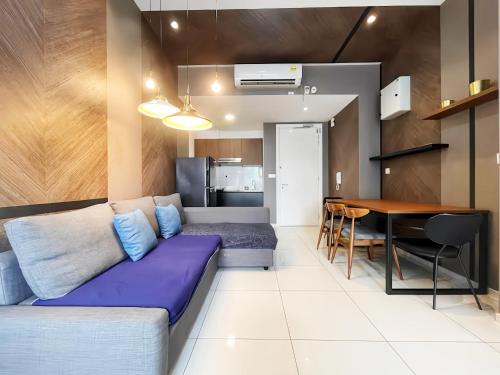 a living room with a couch and a table at The Robertson Bukit Bintang in Kuala Lumpur