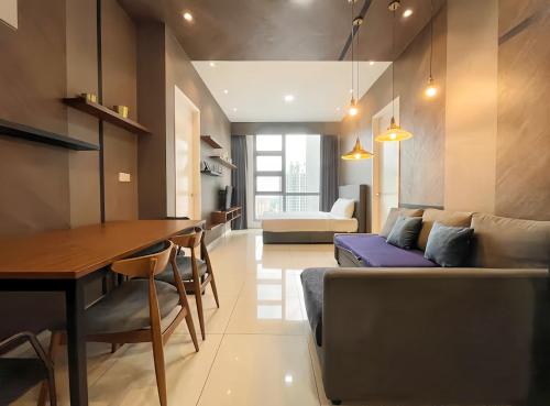 a living room with a couch and a table at The Robertson Bukit Bintang in Kuala Lumpur