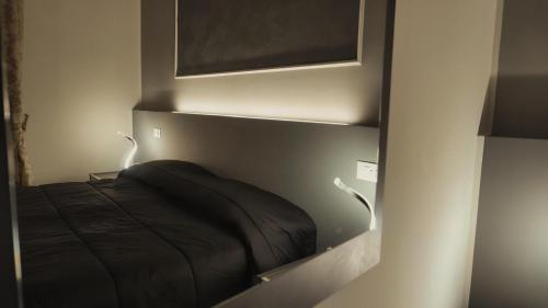 Ένα ή περισσότερα κρεβάτια σε δωμάτιο στο Palazzo Ducale Suites