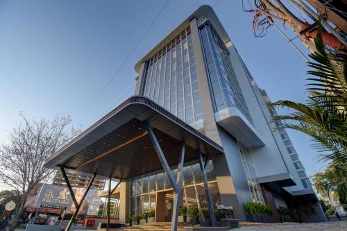 a tall building with a lot of windows at THE SSK Solitaire , Boutique Hotel and SPA in Nashik