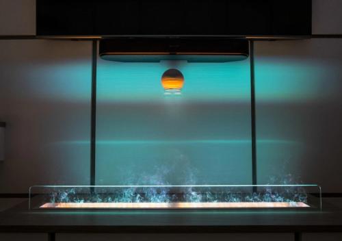 a light in a aquarium with smoke in it at Ulivi Bianchi Luxury Home in Puglia in Putignano