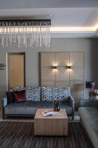 a living room with a couch and a coffee table at Metzgerwirt in Hippach