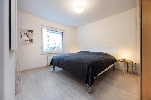 Ένα ή περισσότερα κρεβάτια σε δωμάτιο στο Modern & central 2-room apartment