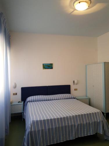 Postel nebo postele na pokoji v ubytování Meublè Andrea Doria