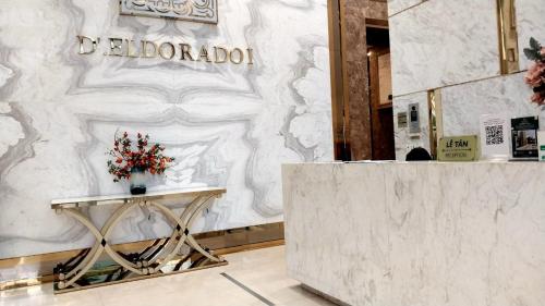a lobby with a table with flowers on it at HT Home D'el Dorado 4 in Hanoi