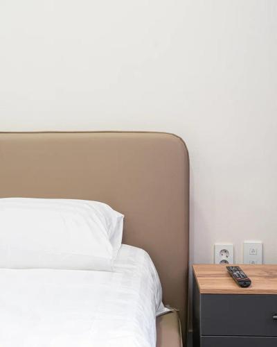 Postel nebo postele na pokoji v ubytování HIGHVILL Apartments by AG Hotels Group