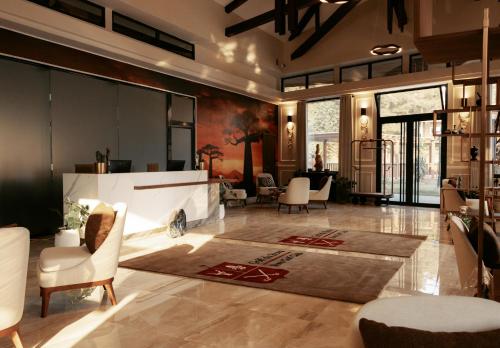 a lobby with chairs and a reception desk at Golf du Rova Luxury Hotel in Antananarivo