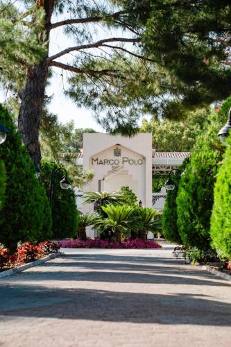 a sign for a tarocapo plot in front of a building at Club Marco Polo - Premium All Inclusive in Kemer