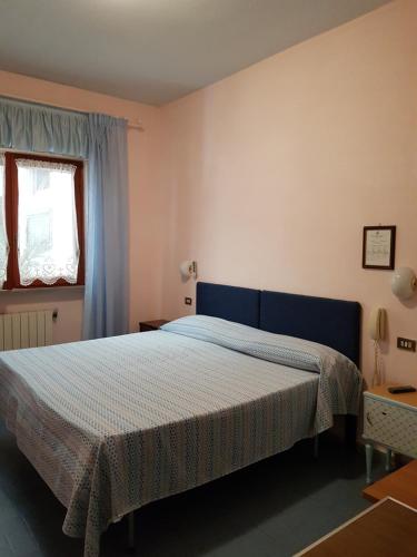 Postel nebo postele na pokoji v ubytování Meublè Andrea Doria