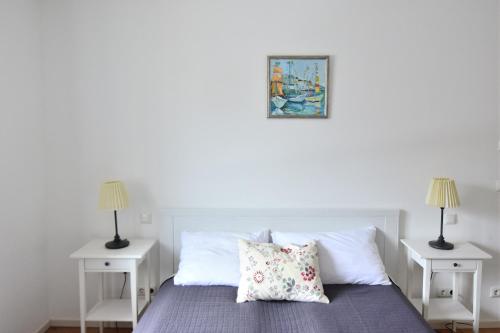 Postel nebo postele na pokoji v ubytování Zugspitze Street Apartment