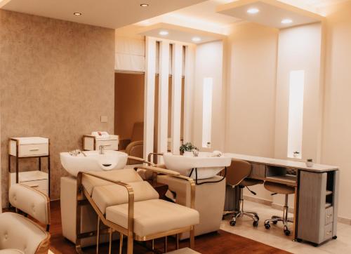 a dressing room with two sinks and a mirror at Golf du Rova Luxury Hotel in Antananarivo
