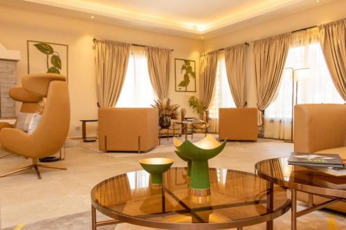 a large living room with a table and chairs at Golf du Rova Luxury Hotel in Antananarivo