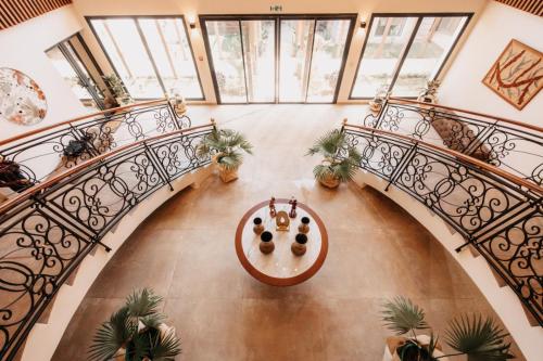 an overhead view of a spiral staircase with plants at Golf du Rova Luxury Hotel in Antananarivo