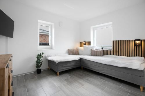 Katil atau katil-katil dalam bilik di Ferienhaus Ebbe
