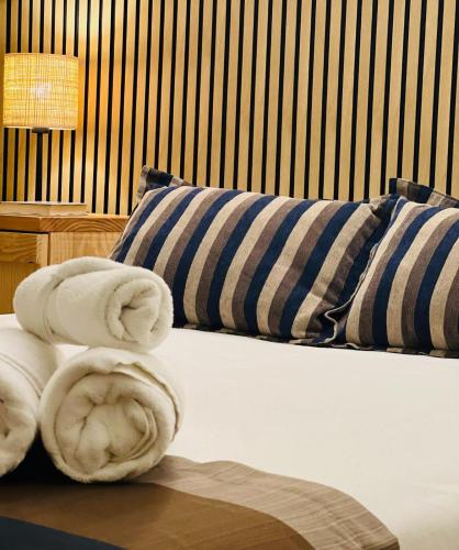 Ένα ή περισσότερα κρεβάτια σε δωμάτιο στο Hotel Escuela San Cristobal