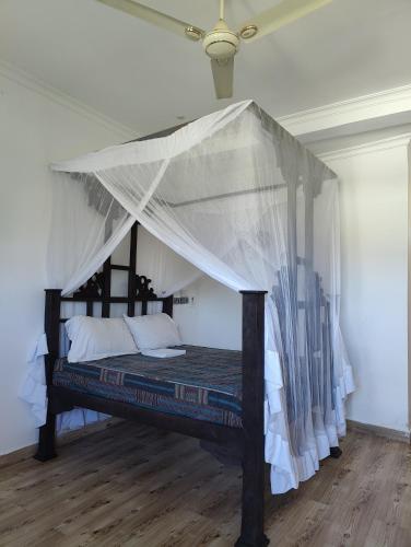 En eller flere senge i et værelse på Sirocco Apartments