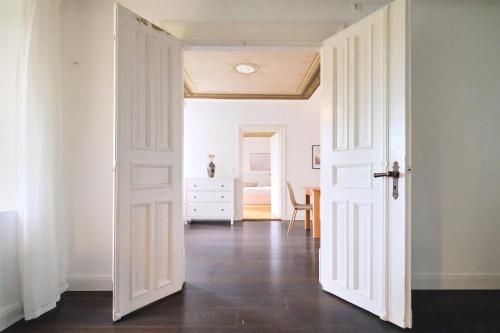 an open door into a room with a dining room at Ferienwohnung Villa Wagersrott in Wagersrott