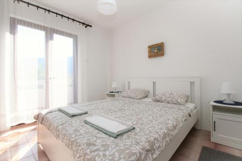 Ένα ή περισσότερα κρεβάτια σε δωμάτιο στο Apartments Teljega