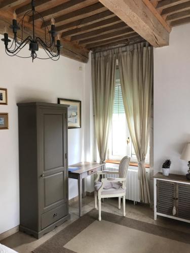 a home office with a desk and a window at Domaine du Manoir in Les Avenières