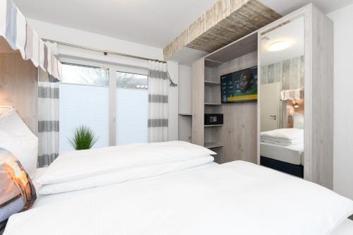Cama o camas de una habitación en Strandkorb 1