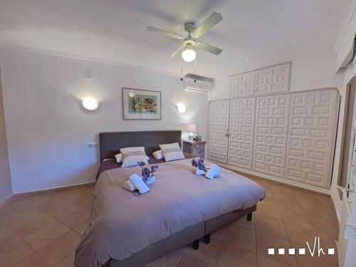 two children sitting on a bed in a bedroom at VH CostaBlanca - MIRASOL in Fanadix